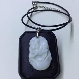 Carved White Pendant on Black Cord Necklace